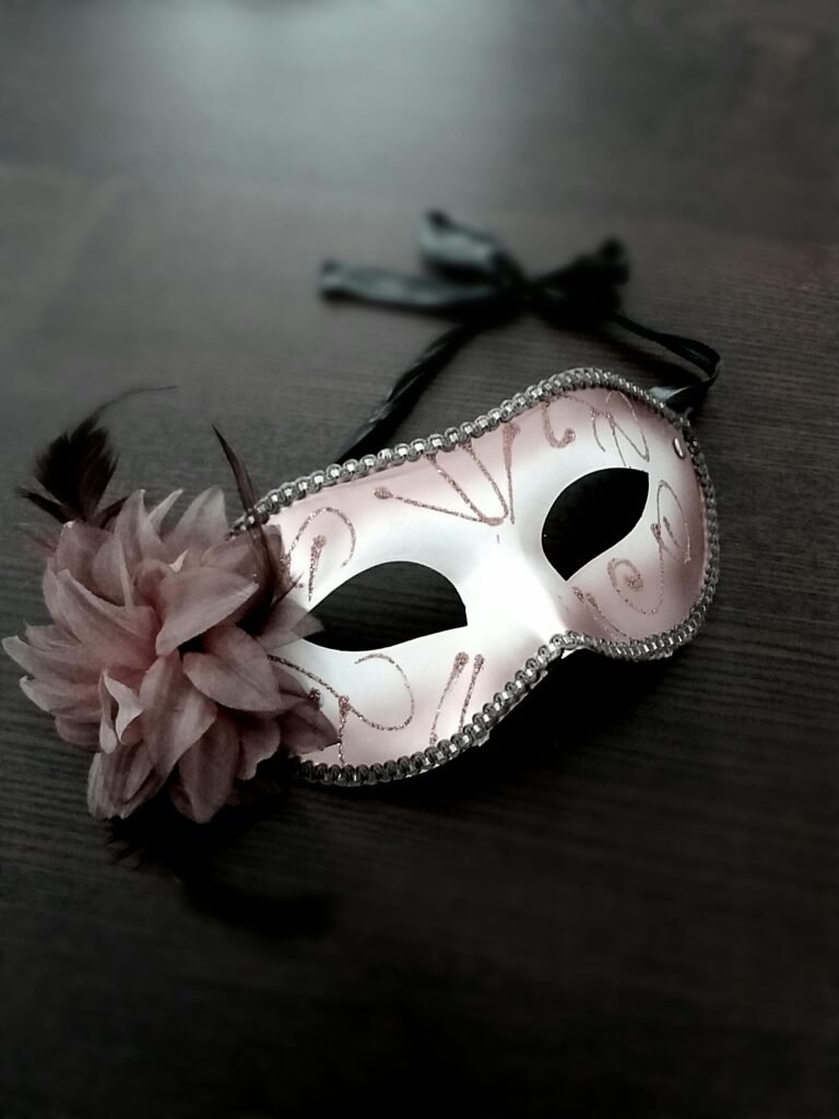 Carnival mask decorated with pink flower